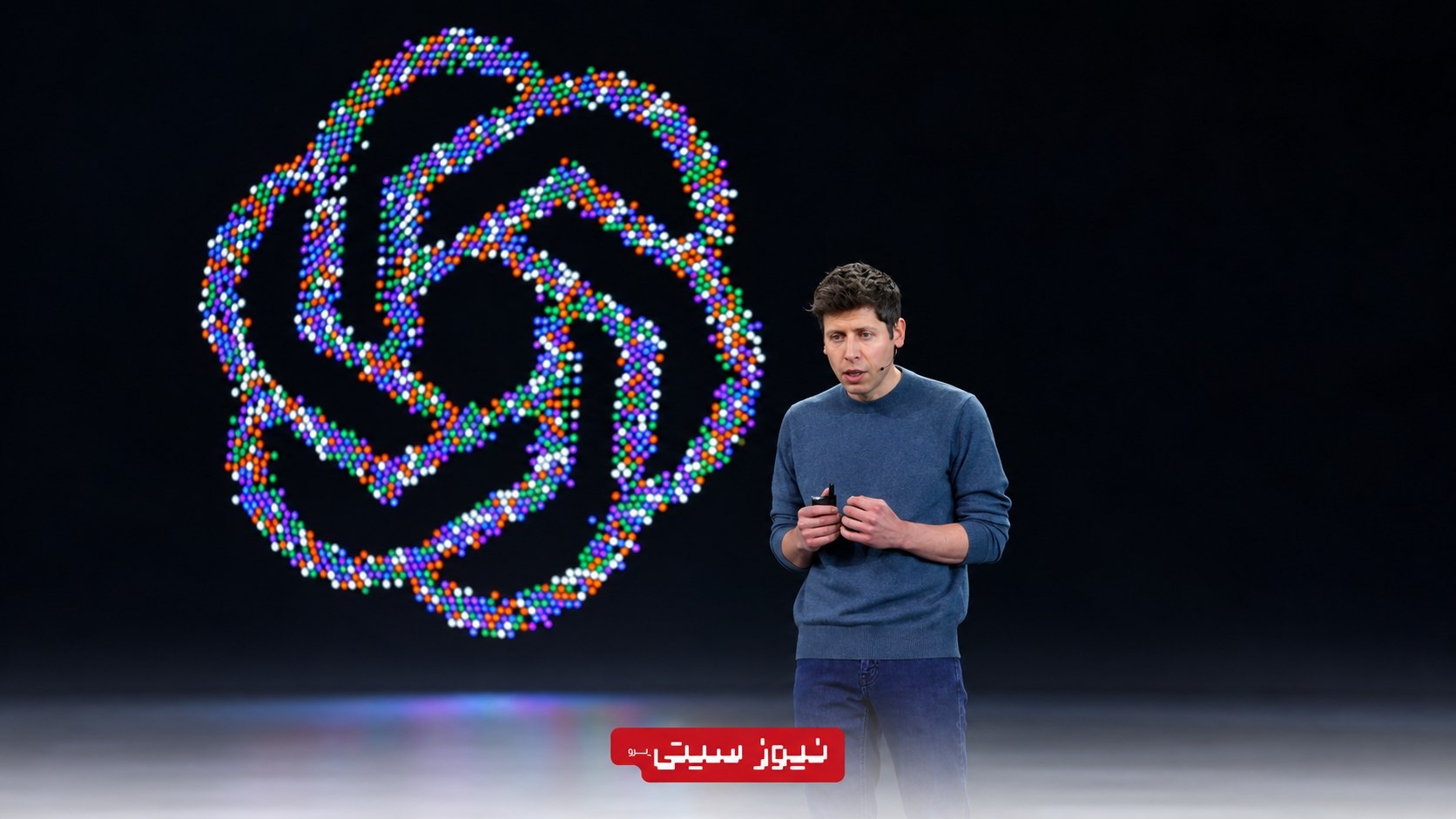 سم آلتمن مدیرعامل OpenAI روی صحنه DevDay 2026 مقابل لوگوی بزرگ OpenAI